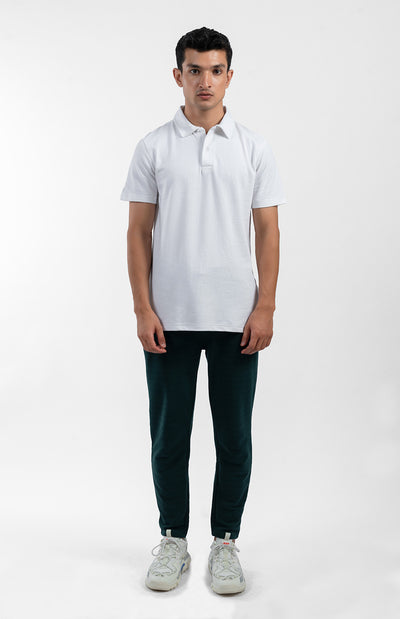 model wearing the white collar polo shirt