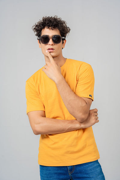 model wearing overtop's mustard color shirt